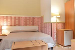Posteľ alebo postele v izbe v ubytovaní Catania Centro Rooms