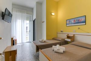 TV a/nebo společenská místnost v ubytování Hotel Villa Merope