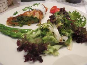 a plate of food with broccoli and vegetables on it at Hotel Aquamarin in Bad Mitterndorf