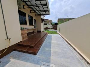 a view from the outside of a house with a fence at Cs Villa Homestay in Ipoh
