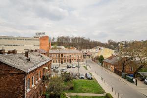 a view of a town with cars parked on a street at Zalgirio Arena Apartment No1 by URBAN RENT in Kaunas