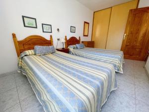 Postel nebo postele na pokoji v ubytování Torres del Sol