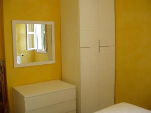 A bed or beds in a room at Residence Ammiraglia Baia Verde