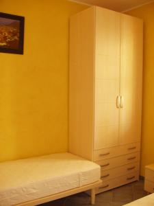 A bed or beds in a room at Residence Ammiraglia Baia Verde
