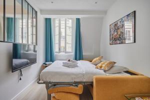 Posteľ alebo postele v izbe v ubytovaní Residence Center of Paris by Studio prestige