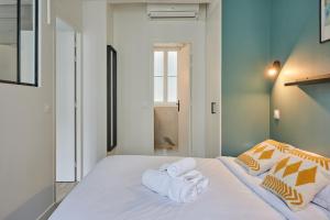 Posteľ alebo postele v izbe v ubytovaní Residence Center of Paris by Studio prestige