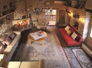 an overhead view of a living room with a fireplace at "Thimises" traditional-stone village house in Kharasón