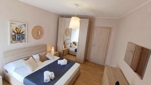 Postel nebo postele na pokoji v ubytování La Terrazza Di Athena sweet rooms