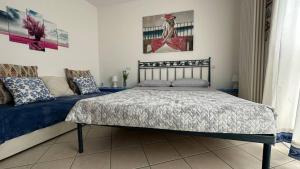 A bed or beds in a room at CA' DEI GELSI BEACH