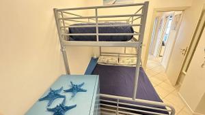A bed or beds in a room at CA' DEI GELSI BEACH