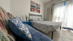 A bed or beds in a room at CA' DEI GELSI BEACH