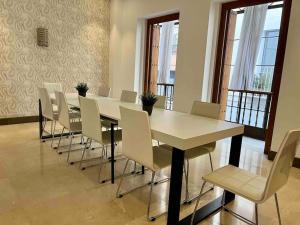a dining room with a table and chairs at Fdez Amazing House by Cathedral and Giralda with private Pool in Seville +47 photos