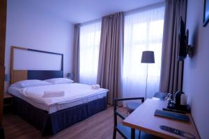 Postel nebo postele na pokoji v ubytování Hotel PAYER II
