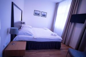 Postel nebo postele na pokoji v ubytování Hotel PAYER II