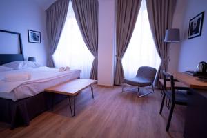 Postel nebo postele na pokoji v ubytování Hotel PAYER II