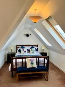 a bedroom with a bed with blue and white pillows at Apartment in Coldstream in Coldstream