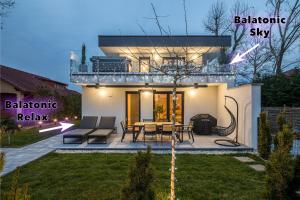 a view of a house with the words balmoral sky and a patio at Balatonic Relax in Zamárdi +38 photos