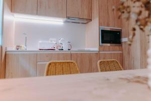 Apartamentos Santa Isabel的电视和/或娱乐中心