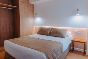 Apartamentos Santa Isabel客房内的一张或多张床位