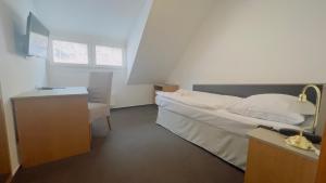 Postel nebo postele na pokoji v ubytování Hotel PAYER