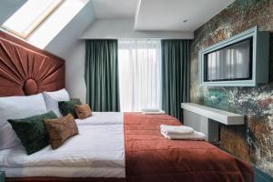 Кровать или кровати в номере NovaWisła Resort & SPA