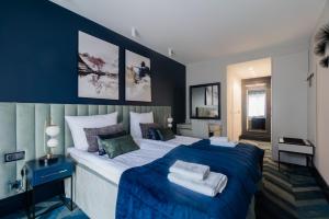 Кровать или кровати в номере NovaWisła Resort & SPA