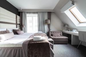 Кровать или кровати в номере NovaWisła Resort & SPA