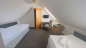 Postel nebo postele na pokoji v ubytování Hotel PAYER