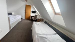 Postel nebo postele na pokoji v ubytování Hotel PAYER