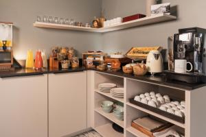 Una cocina o zona de cocina en Hostellerie du Grünewald