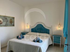 En eller flere senge i et værelse på Villa Gaios - Piscina Privata By Cala Salento + 41 billeder