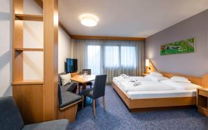 Posteľ alebo postele v izbe v ubytovaní Familienhotel Viktoria