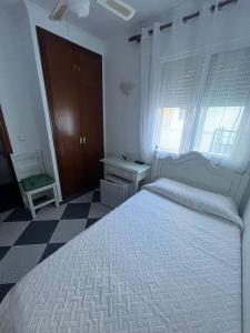 Postel nebo postele na pokoji v ubytování Hostal Restaurante La Giralda