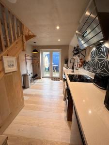 a kitchen with a sink and a counter top at Sea View Nook in Porthtowan