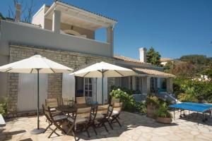 The swimming pool at or close to Avlaki Beach House,stylish villa in Kassiopi