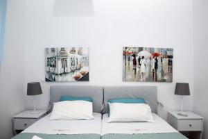 A bed or beds in a room at Avlaki Beach House,stylish villa in Kassiopi