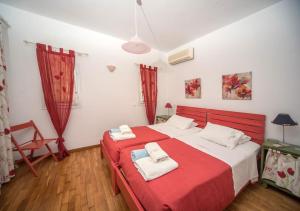 A bed or beds in a room at Avlaki Beach House,stylish villa in Kassiopi