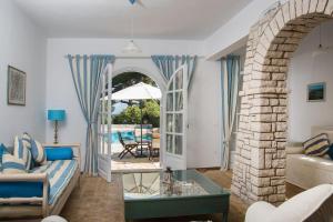 A seating area at Avlaki Beach House,stylish villa in Kassiopi