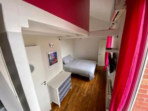 Posteľ alebo postele v izbe v ubytovaní P'tite maison du Parc
