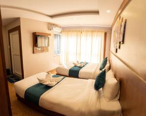 Uma cama ou camas num quarto em Majheri Resort and Spa