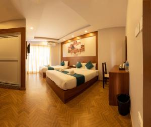 Uma cama ou camas num quarto em Majheri Resort and Spa