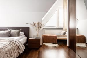 Posteľ alebo postele v izbe v ubytovaní APARTAMENT WASILÓWKA ZAKOPANE przy Krupówkach