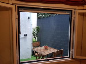 a sliding glass door with a table in front of a window at Apartamento El Corazón de Gredos in Arenas de San Pedro
