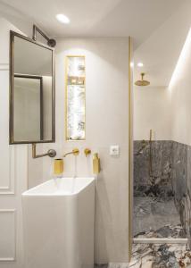 a bathroom with a sink and a mirror at Bella Venezia in Corfu