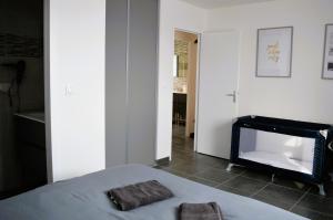 Posteľ alebo postele v izbe v ubytovaní La Mer Veille, maison neuve avec jardin