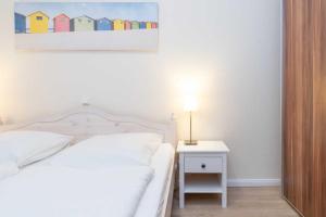 Un pat sau paturi într-o cameră la Villa Marin Wohnung 05 +24 fotografii