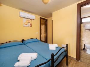Postel nebo postele na pokoji v ubytování Anxur Village Camping