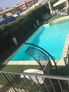 a view of a swimming pool from a balcony at Villa Margherita in Pozzallo