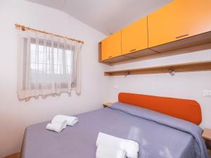 Postel nebo postele na pokoji v ubytování Anxur Village Camping