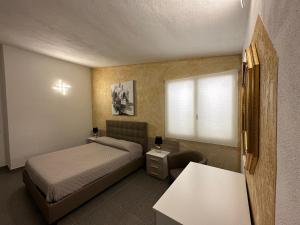 Voodi või voodid majutusasutuse LXR Rooms Carloforte toas